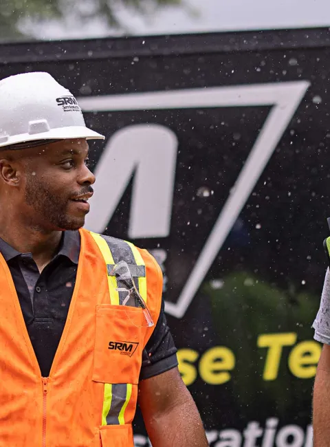 SRM workers in front of truck