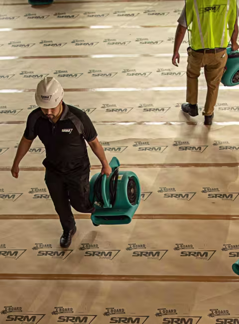 SRM workers walking with equipment