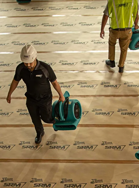 SRM workers walking with equipment