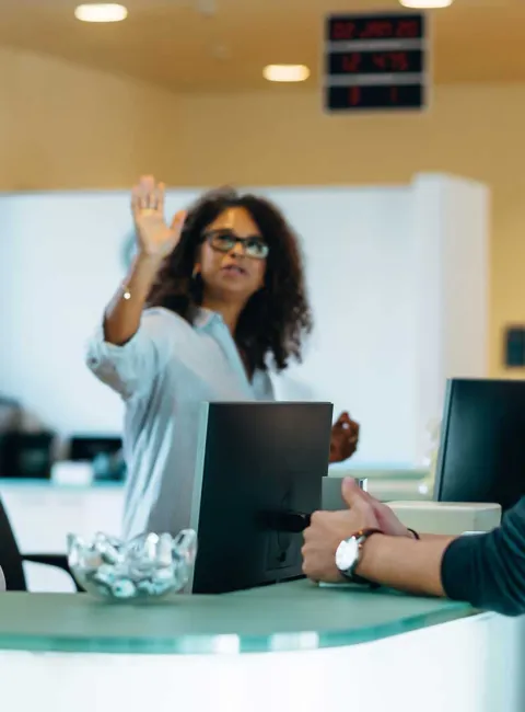 Customers at front desk of office building