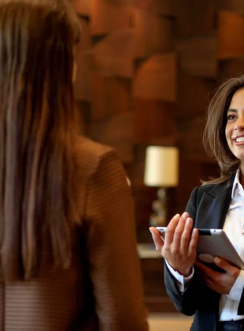 Hotel manager with customer