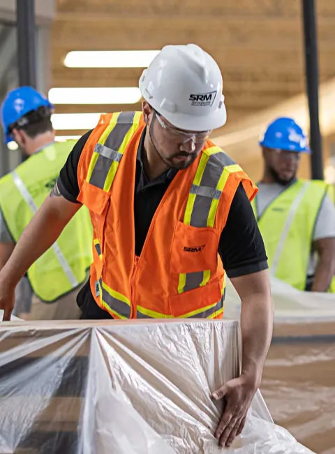 SRM workers covering equipment