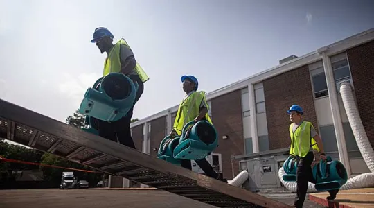 SRM workers walking up ramp